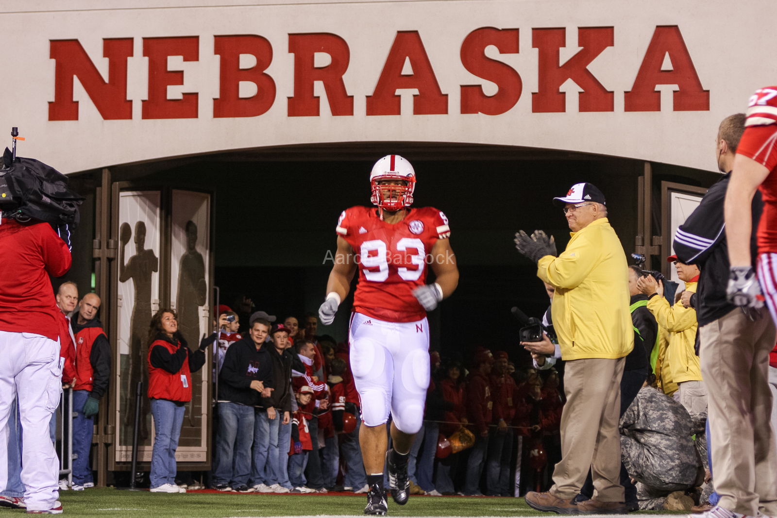Ndamukong Suh runs out of the tunnel on Senior Day at Memorial Stadium prior to Nebraska's game against Kansas State on Nov. 21, 2009. © Aaron Babcock