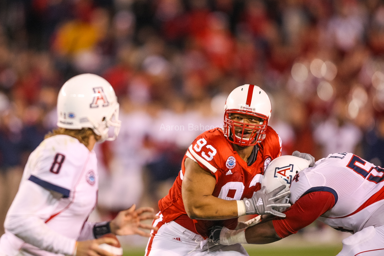 Ndamukong Suh pursues Arizona quarterback Nick Foltz during a 33-0 win in the Holiday Bowl on Dec. 30, 2009. © Aaron Babcock
