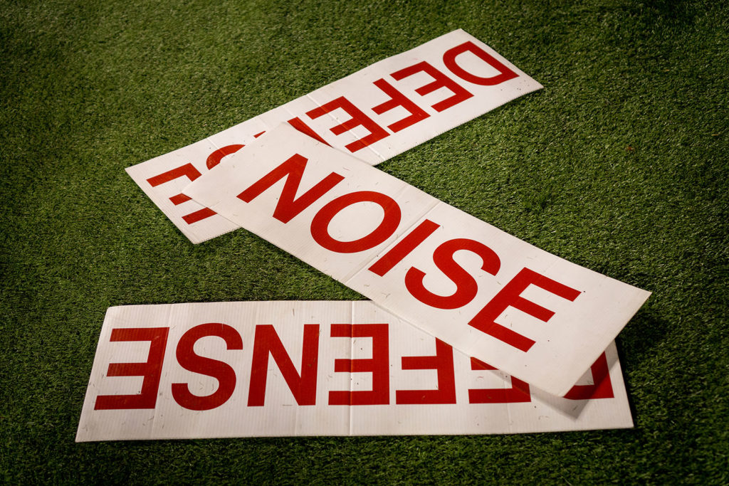 football cheerleading signs on the turf