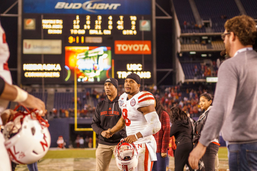 football players leaving field